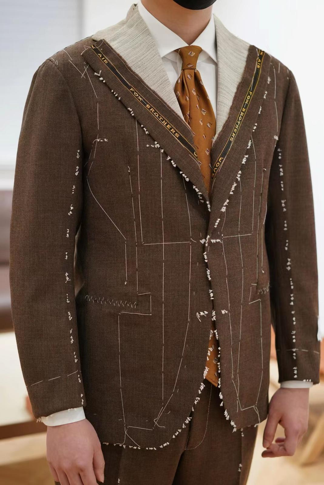 Person wearing suit during fitting