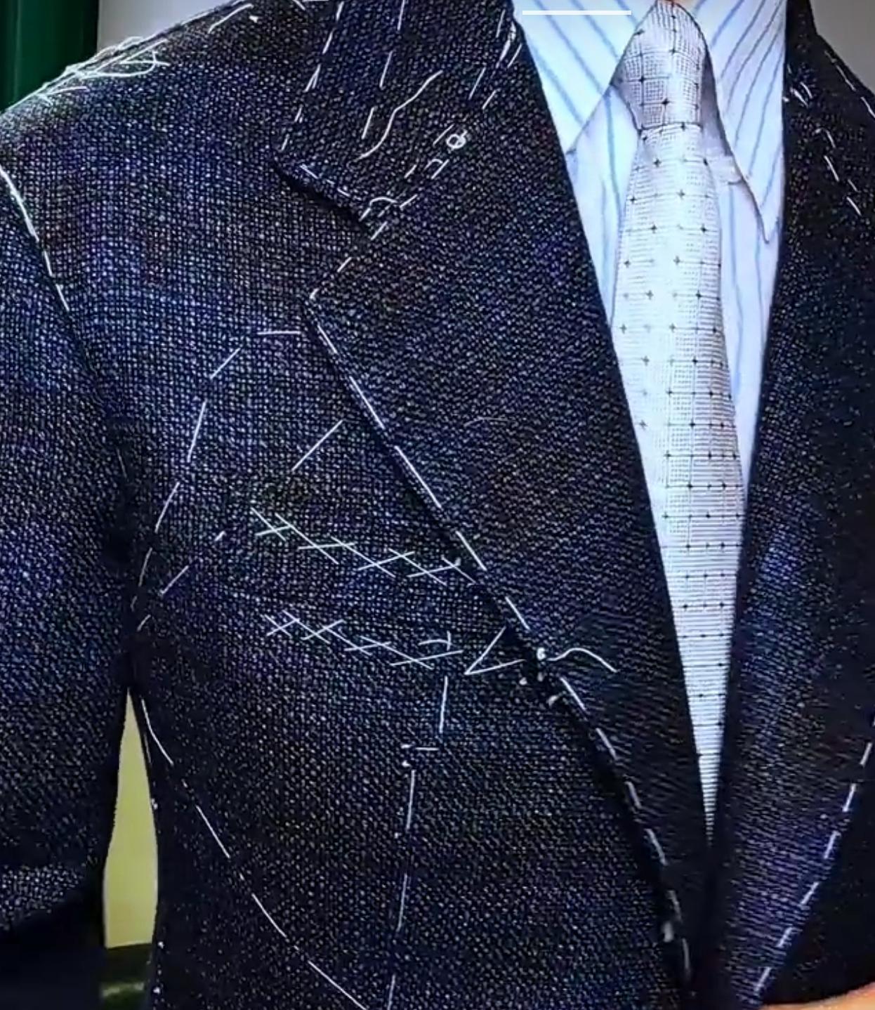 Suit being fitted with design markings